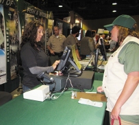 purchasing a fishing license at a sports show